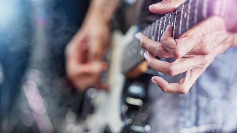 electric guitar player close-up