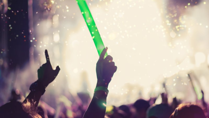 fans holding light sticks