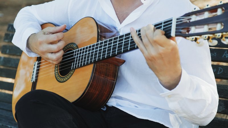 acoustic guitar player close-up