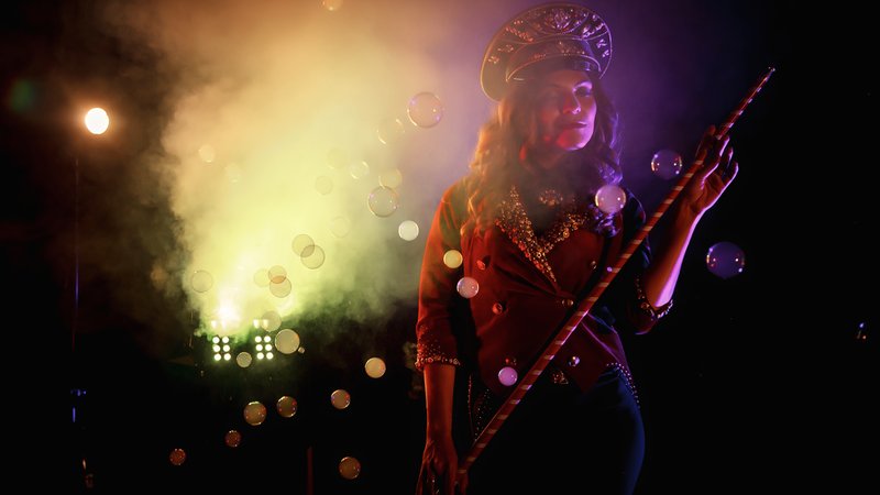 musician playing guitar on stage