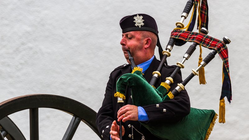 Scottish bagpiper outdoors
